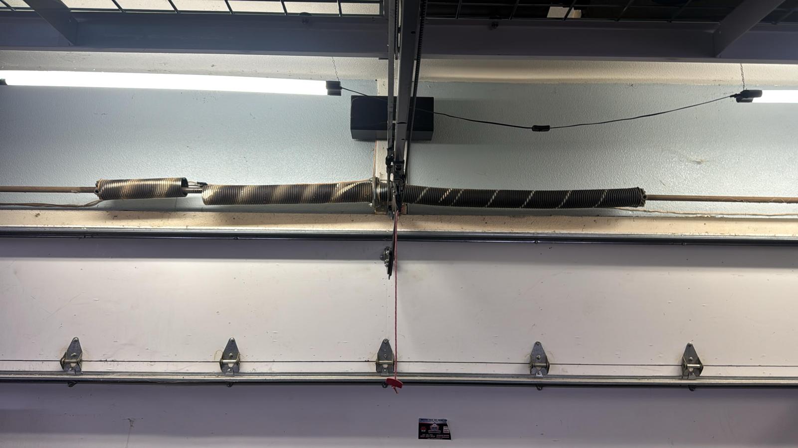 Garage door spring repair — before